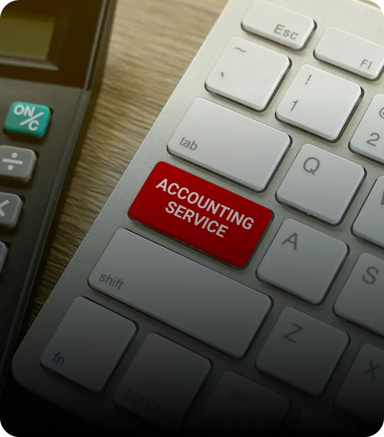 Keyboard with "Accounting Service" key, calculator nearby.